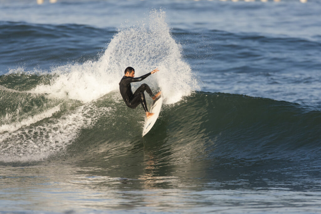 sean brody on a performance surfboard rental surfing a nice power turn on left-hand wave