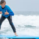 Pre teen surfing at Surf Education Academy surf camp in San Diego at La Jolla Shores