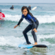 mini grom surfing at Surf Education Academy surf camp in San Diego at La Jolla Shores