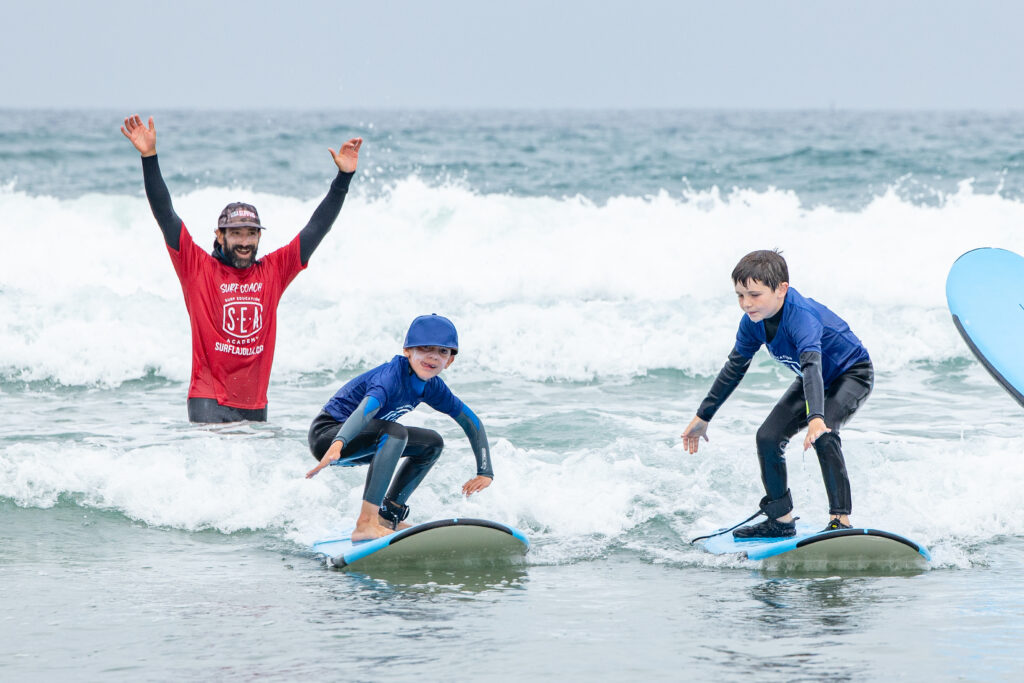 Surf Education academy surf camp at la jolla shores with kids happy to spend a week of surf camp summer 2025 in san diego