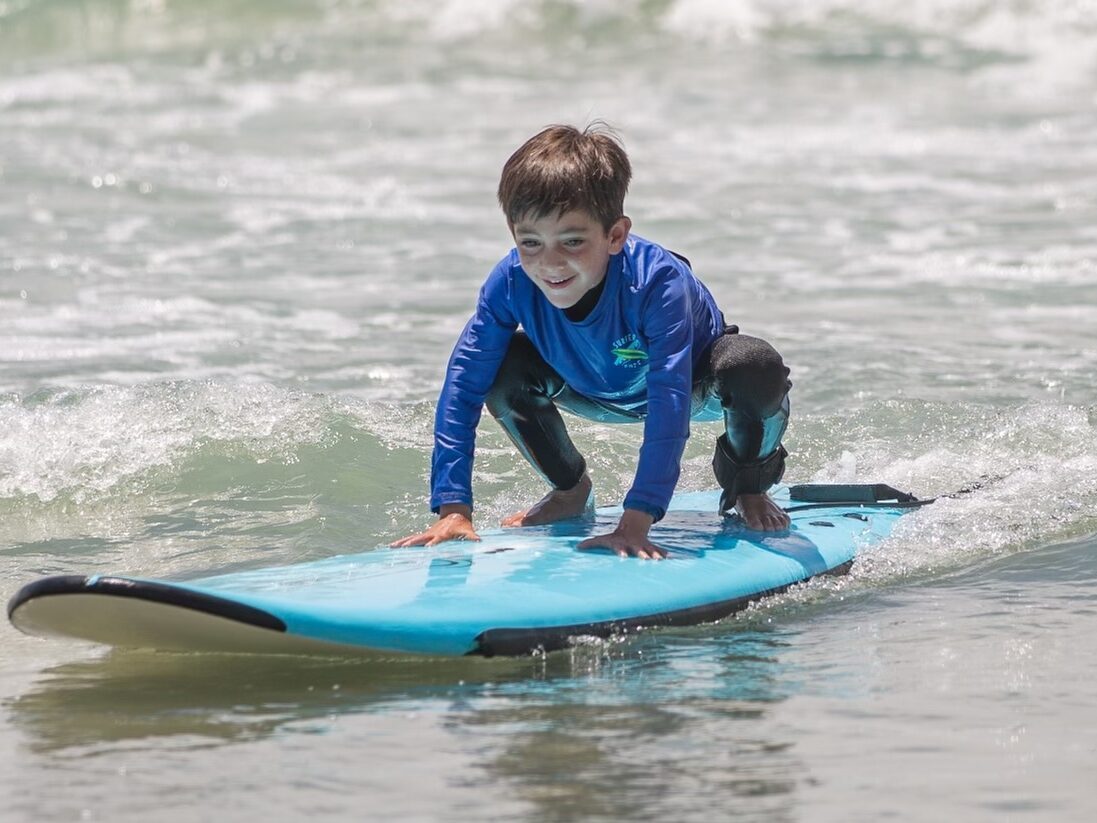 Surf Eduation Academy Mini Grom Surf Camp kids surfing in La Jolla Shores