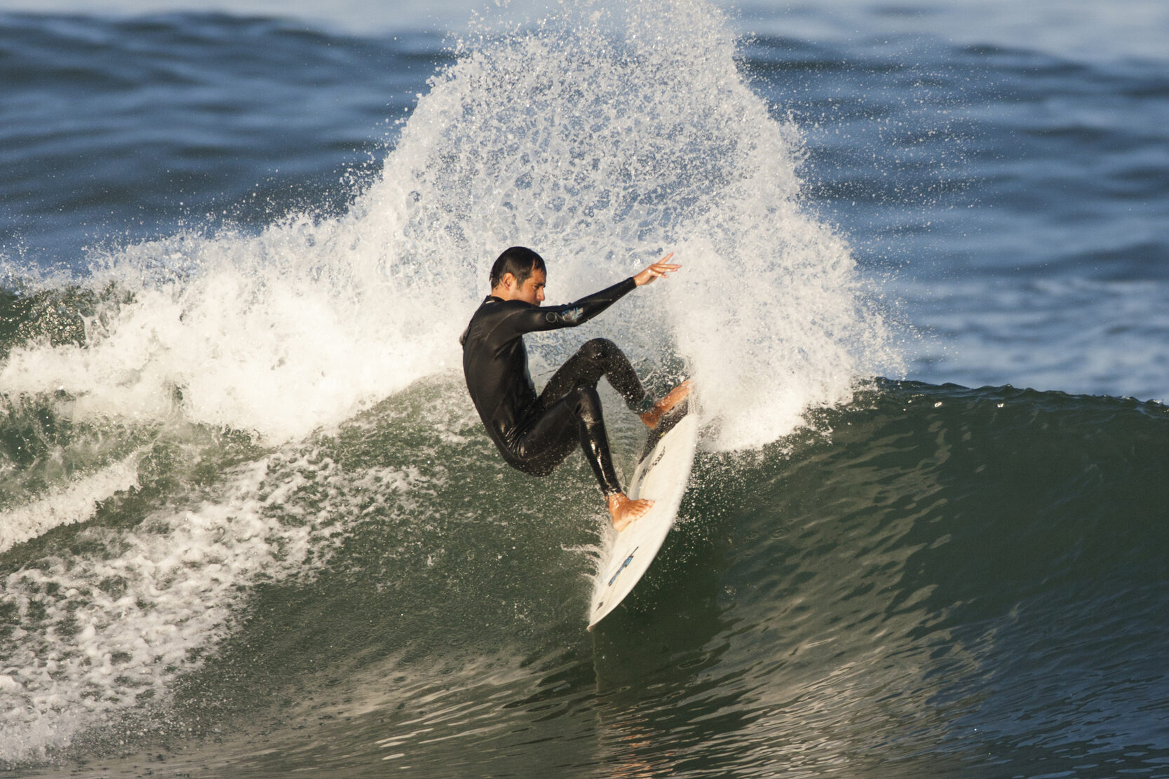 sean brody on a performance surfboard rental surfing a nice power turn on left-hand wave